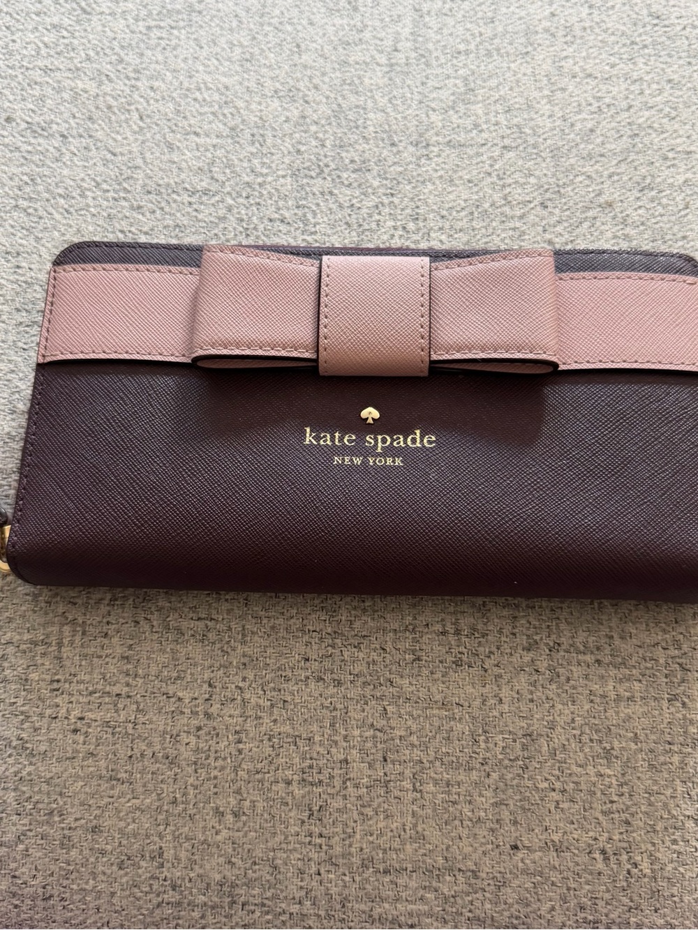 kate spade two-tone bow continental wallet in burgundy and blush